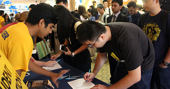 Students talking at Graduate College event